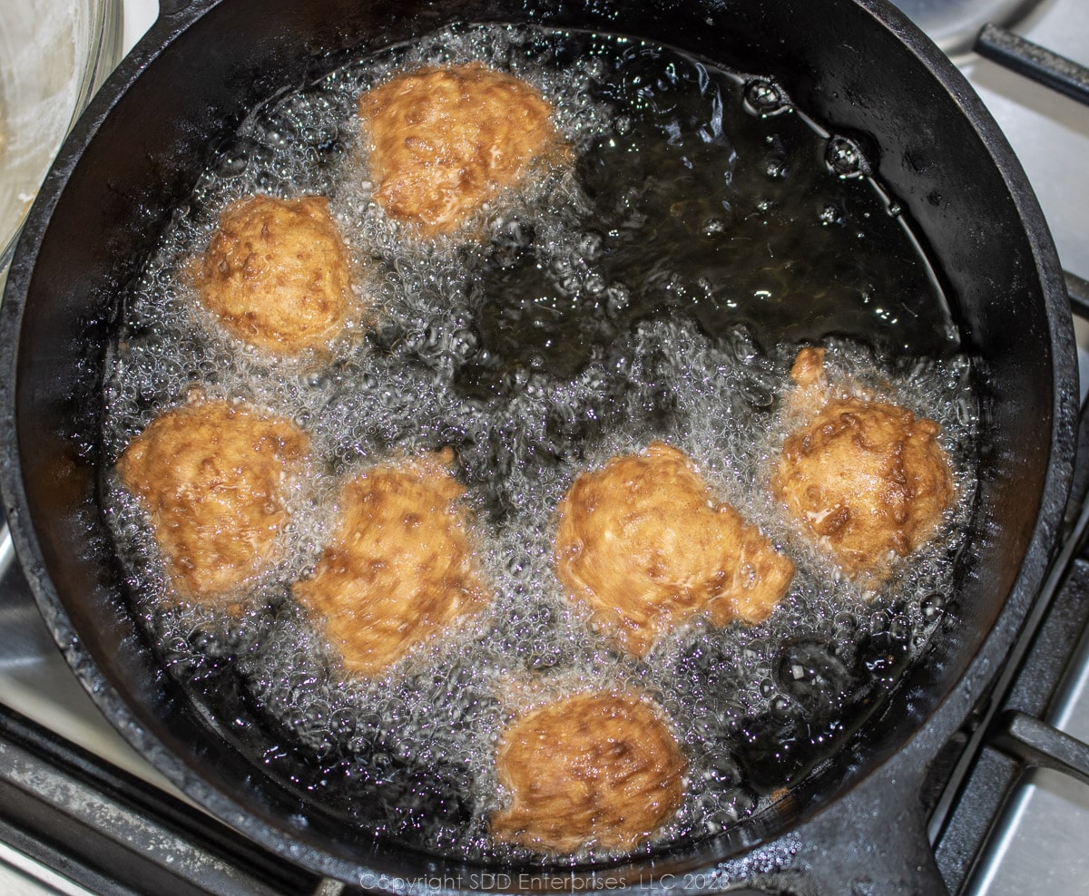 calas frying in a Dutch oven