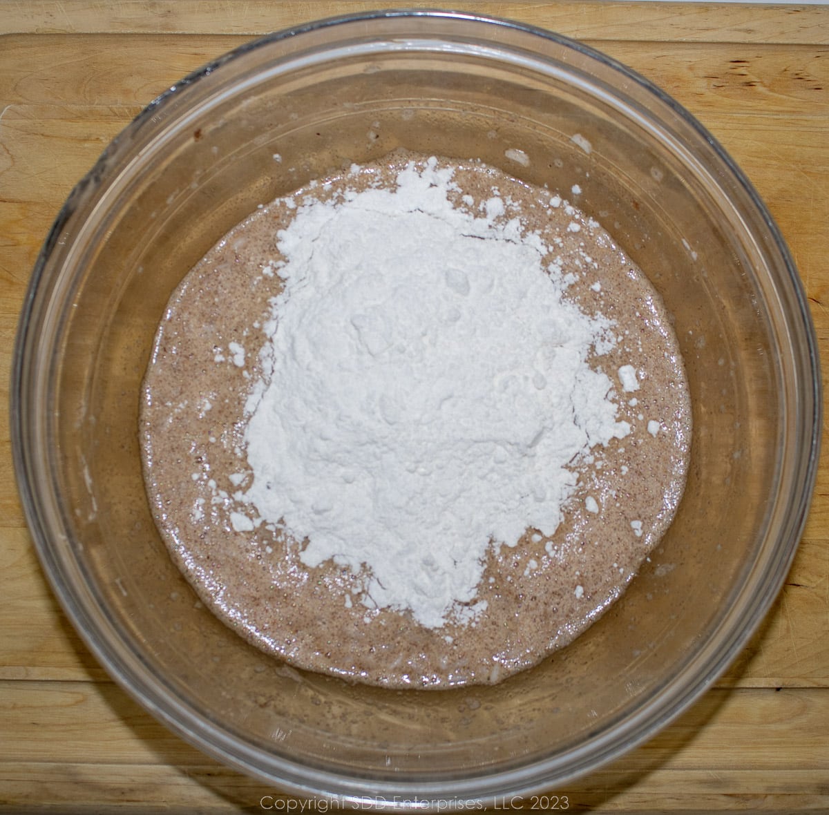 AP flour being added to the spiced egg and rice mixture