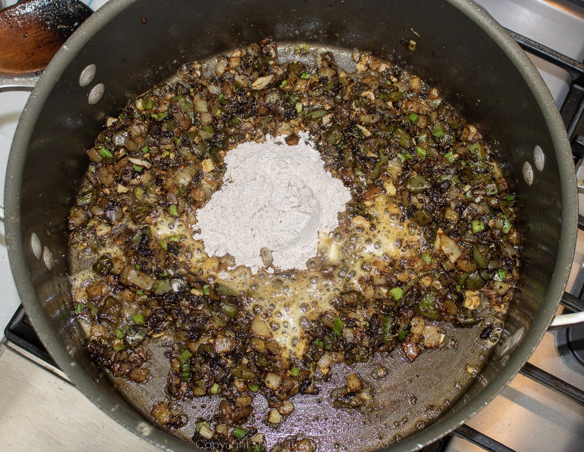 flour and butter added to cooked Trinity in a Dutch oven