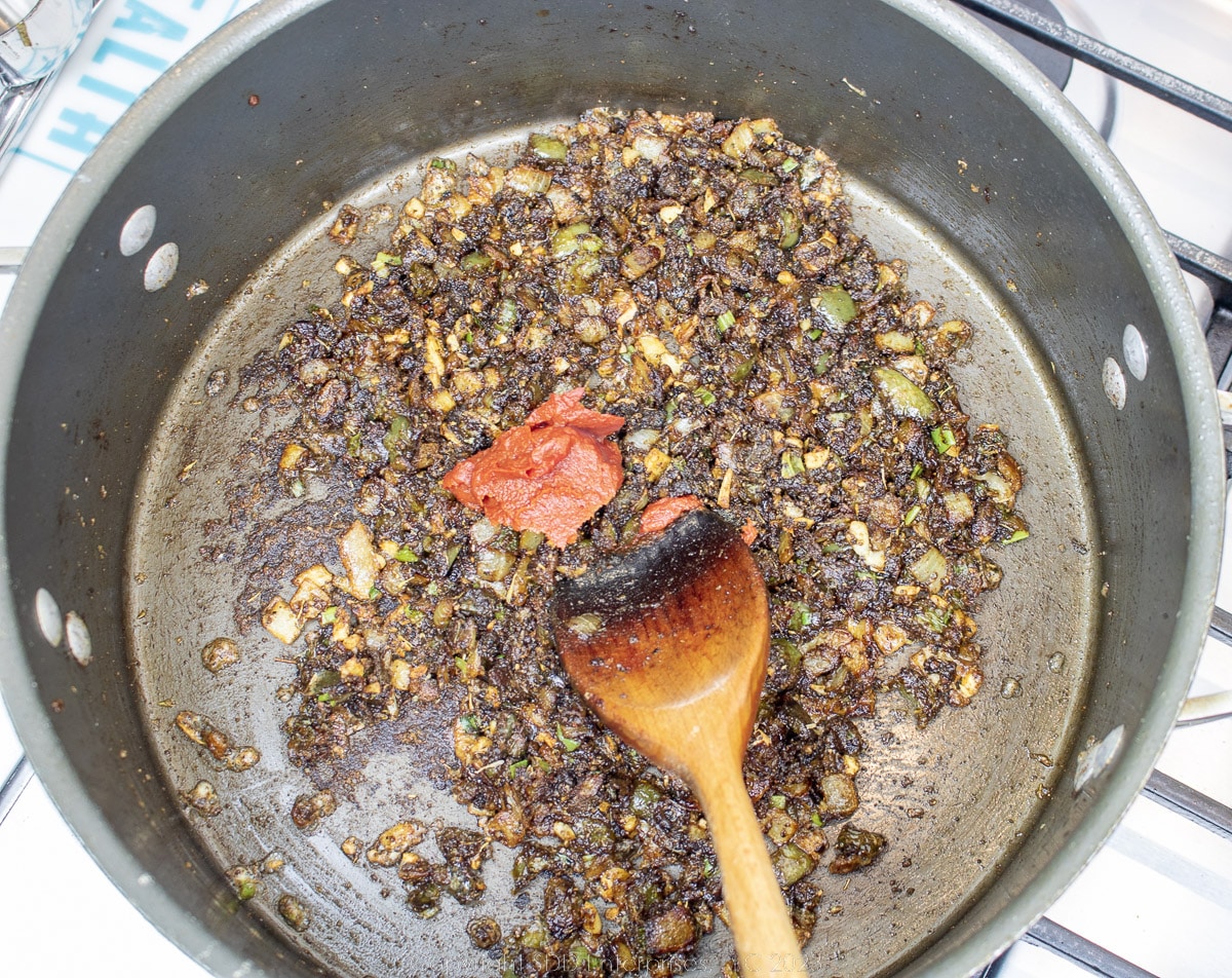 tomato paste added to browned trinity and flour