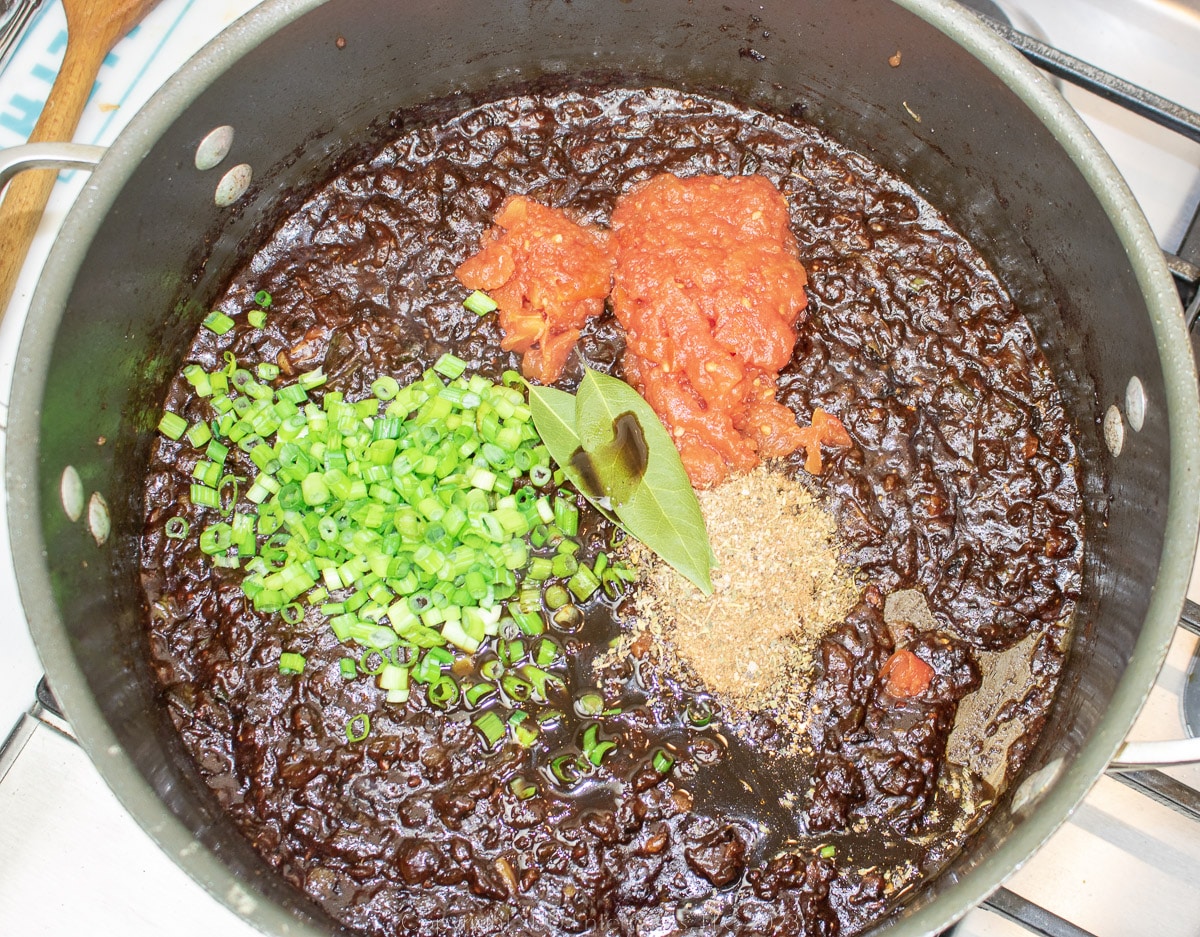 tomatoes, onions and herbs added to dutch oven