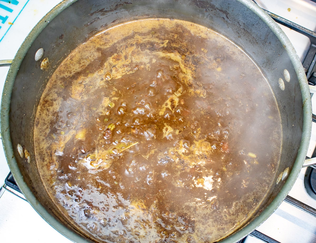 simmering gravy in a dutch oven