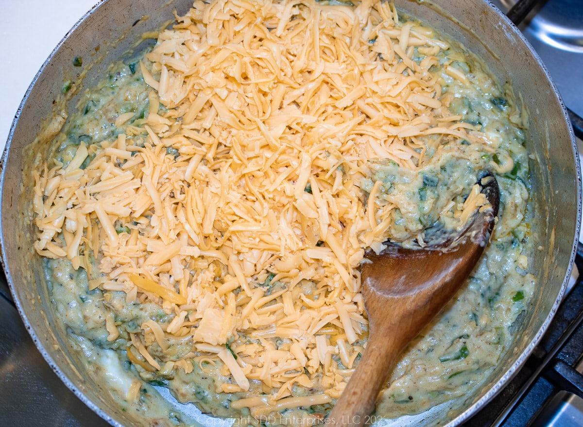 grated American cheese added to the cream sauce