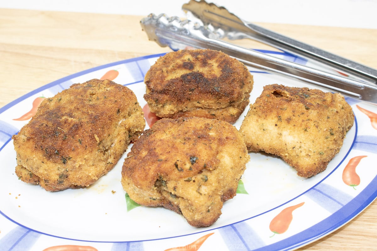 baked chicken kiev resting after baking