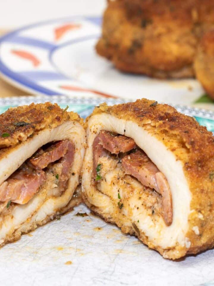 chicken kiev cut in half on a plate