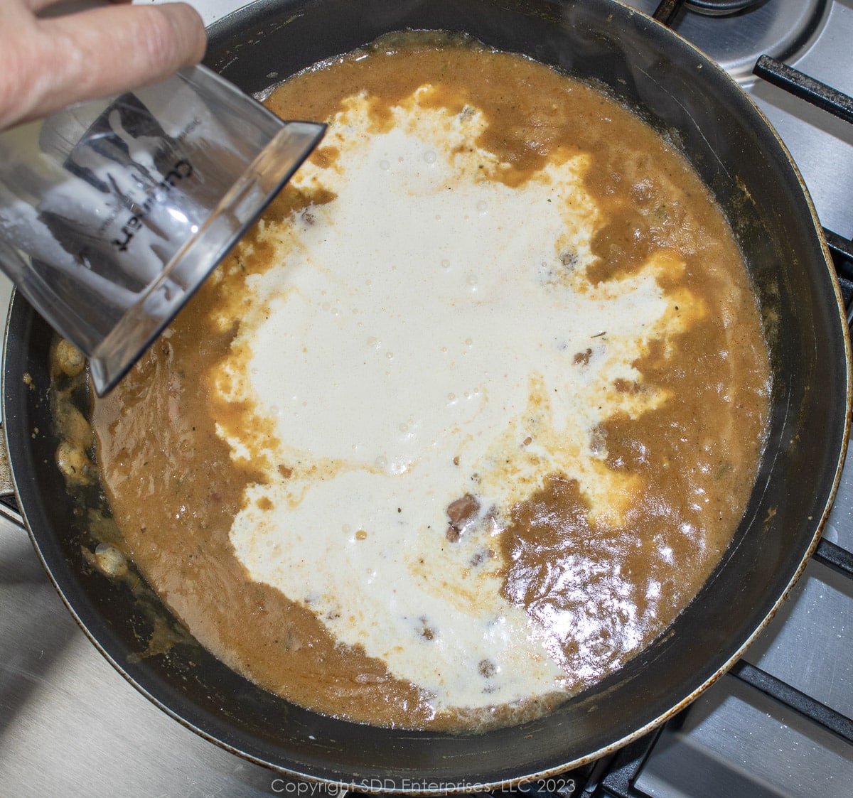 heavy cream added to the sauce created in a sautée pan