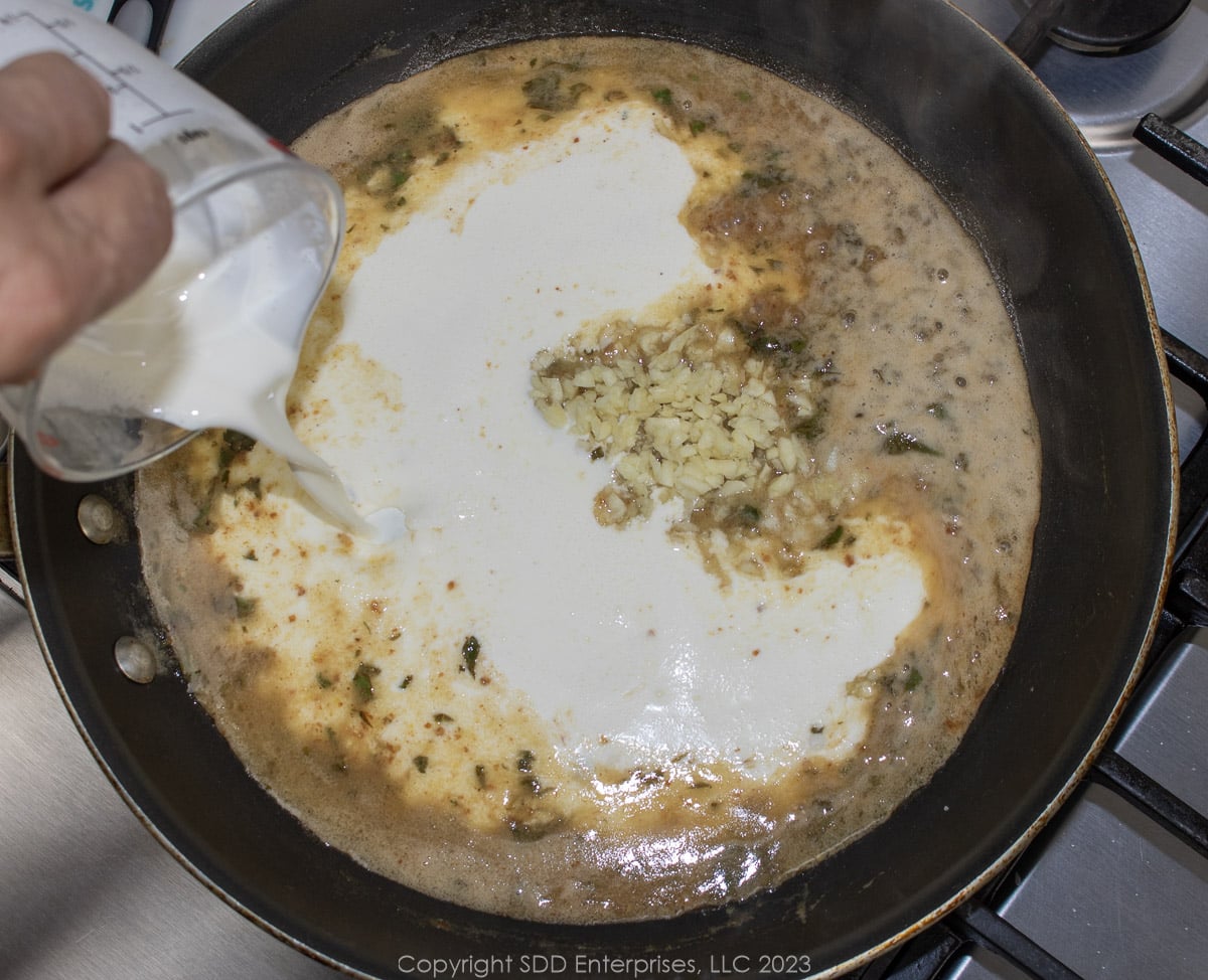 heavy cream and garlic added to melted butter and marinade in a saute pan