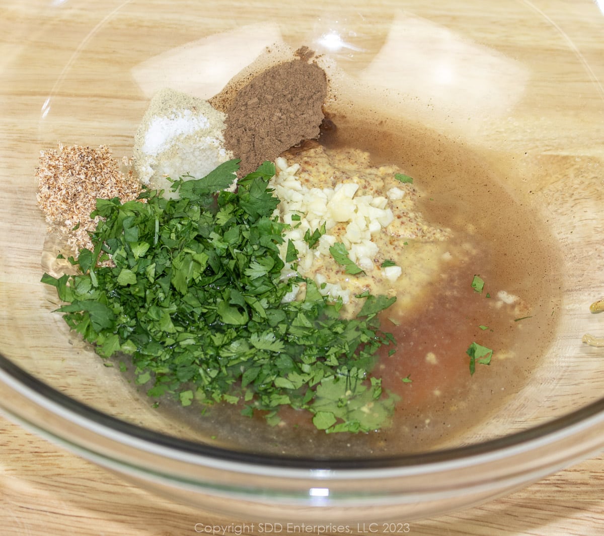 combined ingredients for marinade in a glass bowl