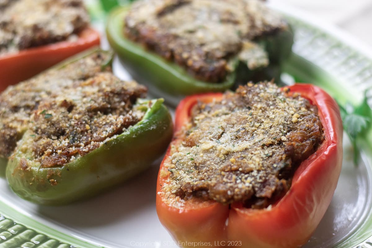 baked bell peppers stuffed with crawfish on a platter