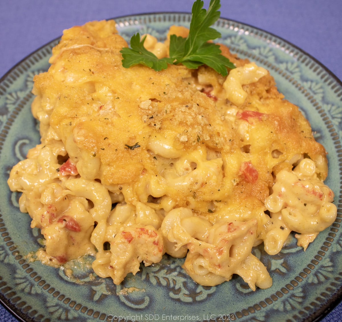 Crawfish Mac and Cheese on a blue green plate