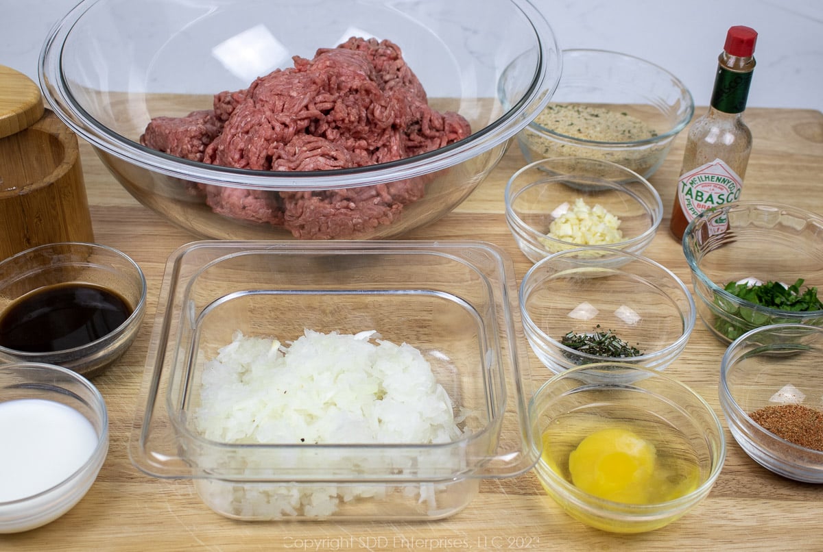 prepared ingredients for salisbury steaks in individual prep bowls