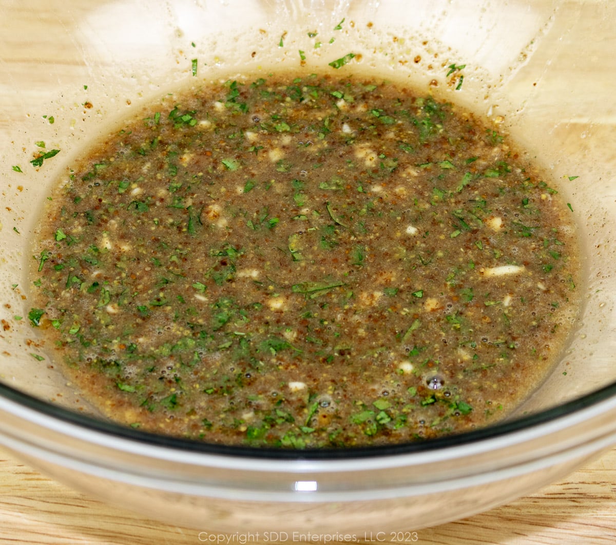 Cilantro Creole Mustard Marinade in a glass bowl