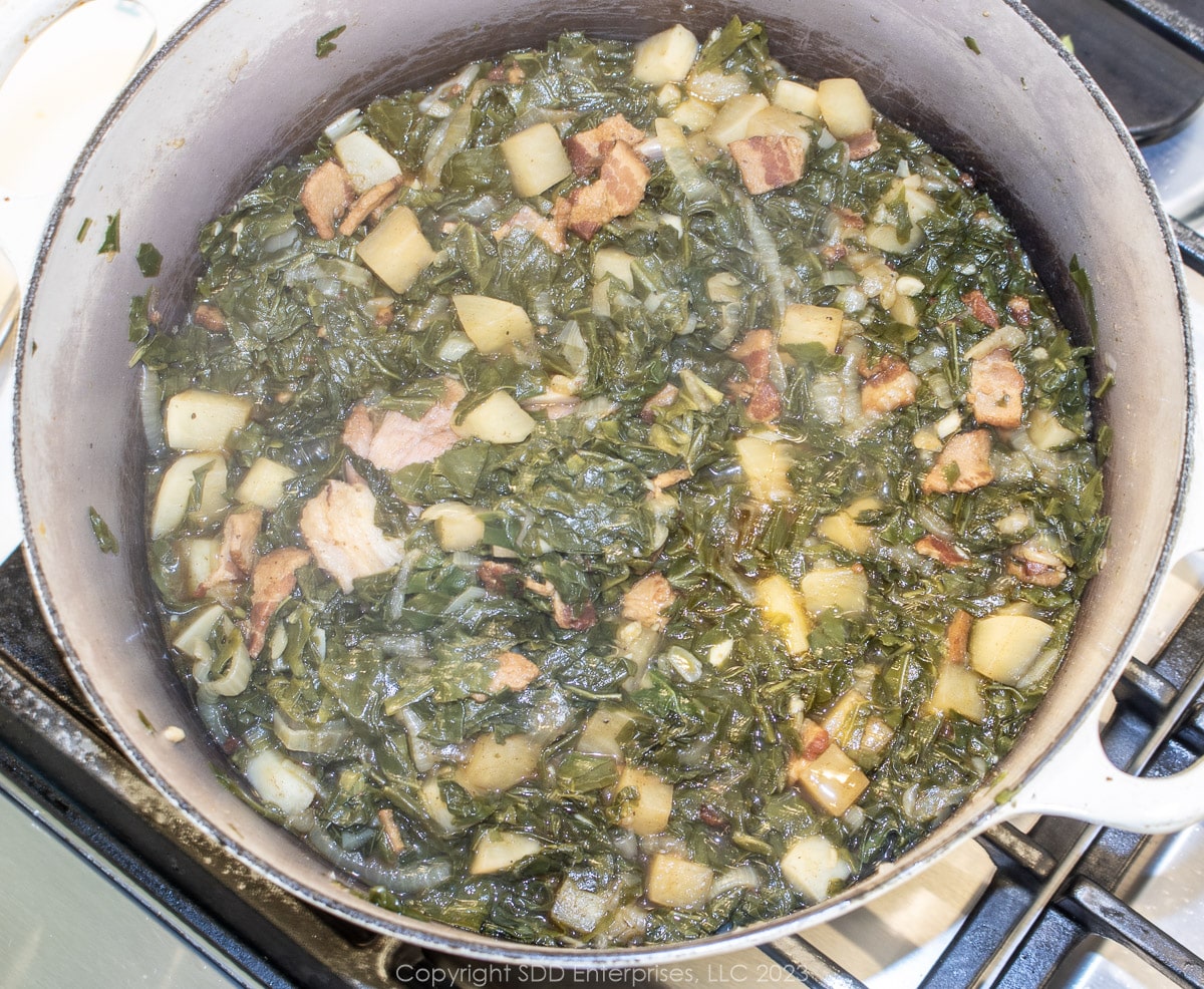 smothering turnip greens in a Dutch oven