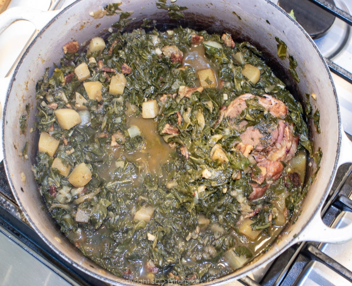 smothering turnip greens in a Dutch oven