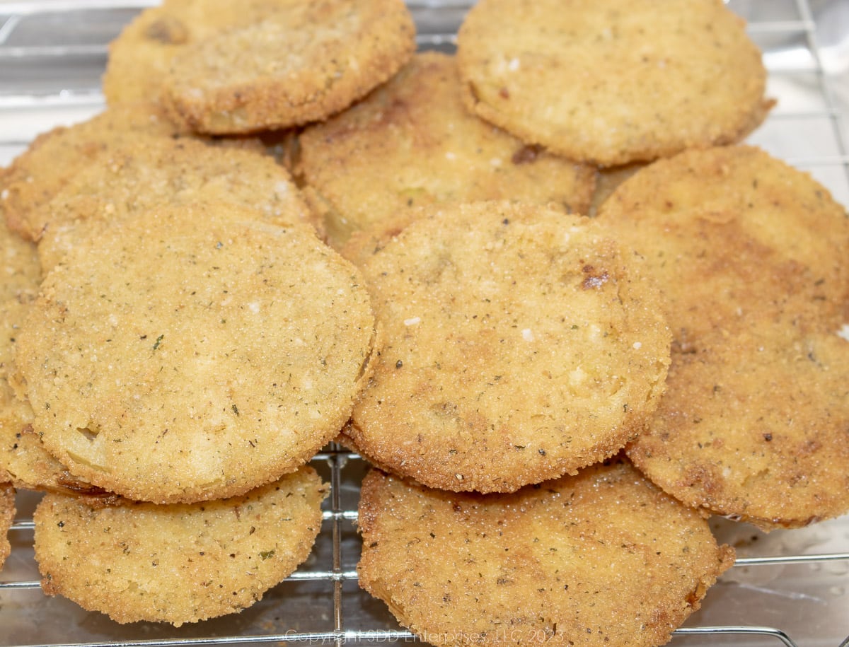 Fried green tomatoes on a cooling rack