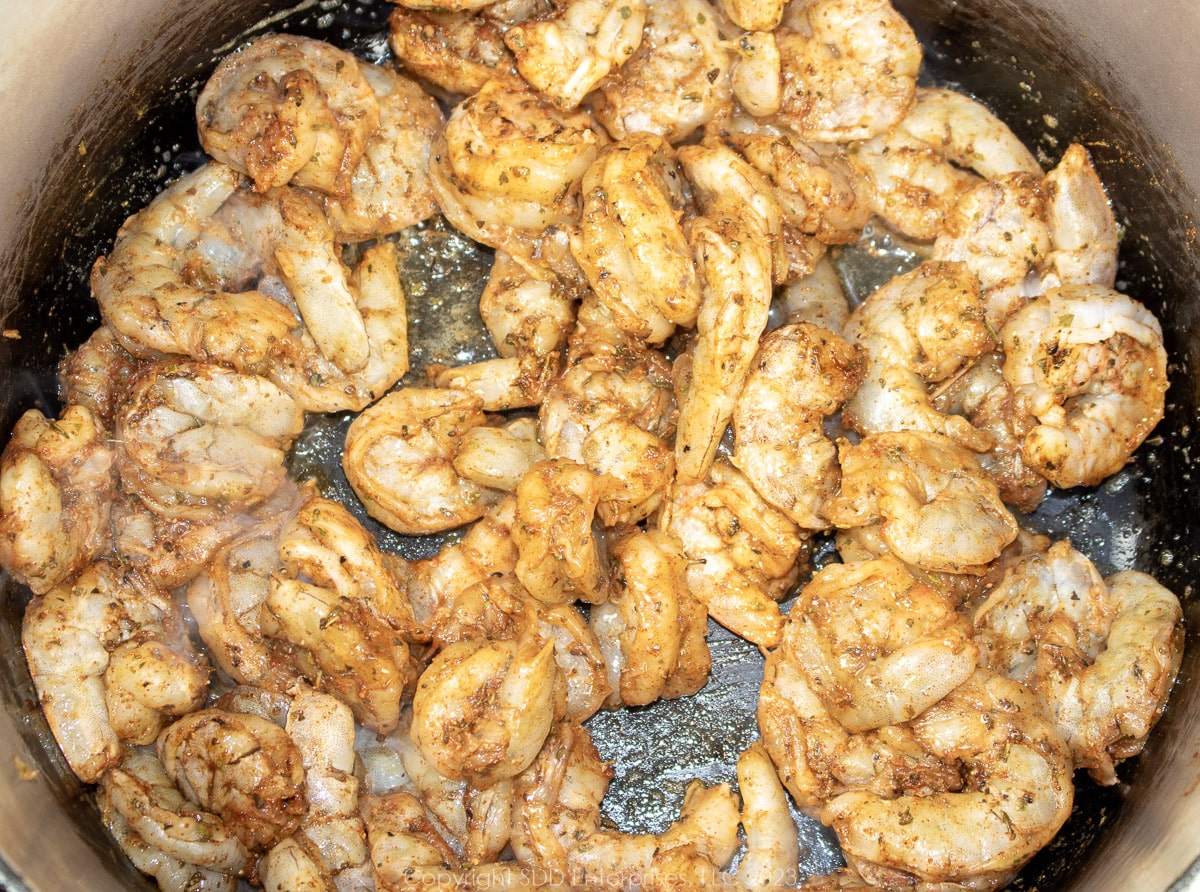 shrimp sautéing in a Dutch oven