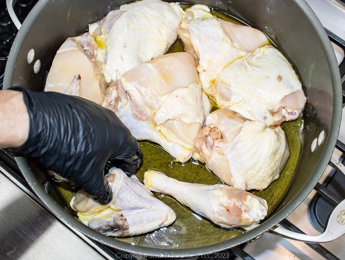 Coat each chicken piece with olive oil.