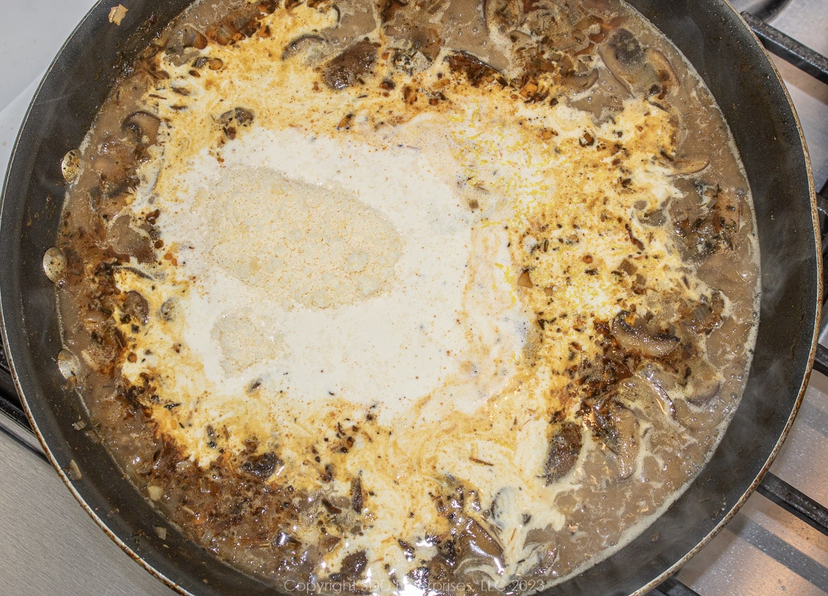 seasonings added with cream to the reduced liquids in a skillet.