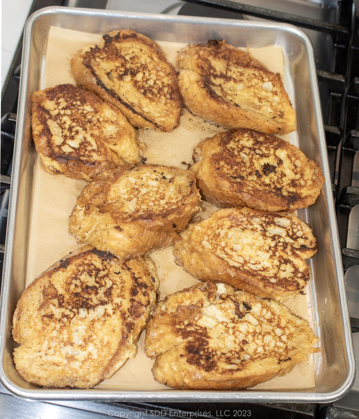Cooked Pain Perdu on a baking pan.