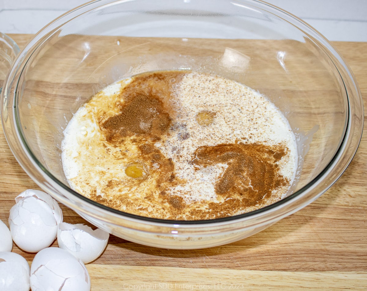 Custard ingredients for Pain Perdu or French Toast in a glass bowl.