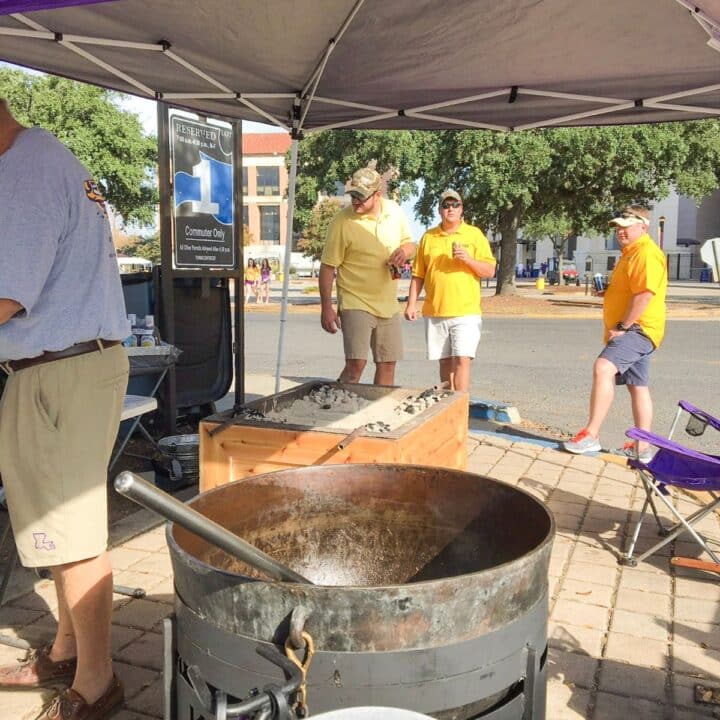 scene from a football tailgate party with a jambalaya pot