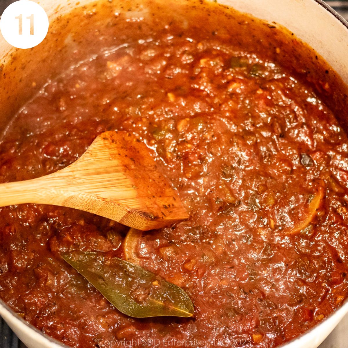 Simmering tomato sauce in a Dutch oven