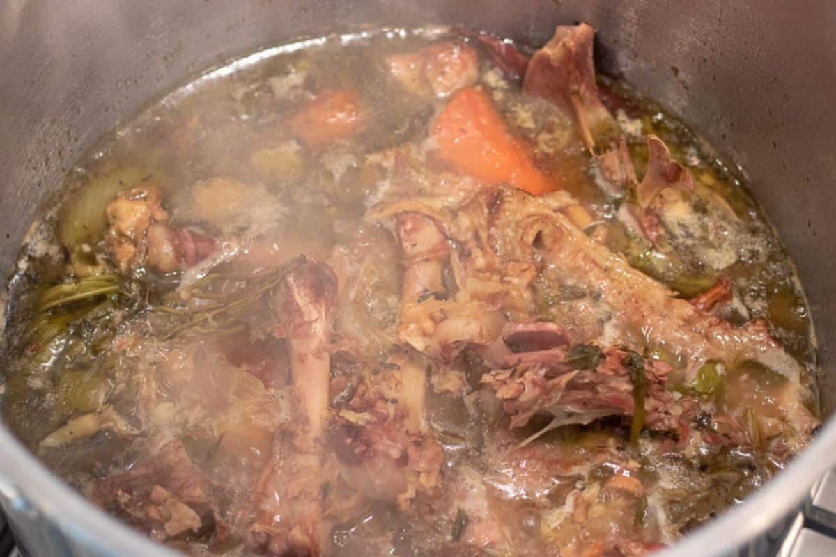 turkey stock simmering in a stock pot