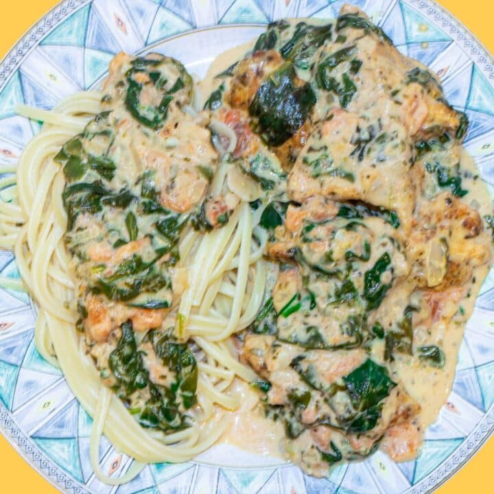 Chicken Florentine with Pasta on a blue green dish