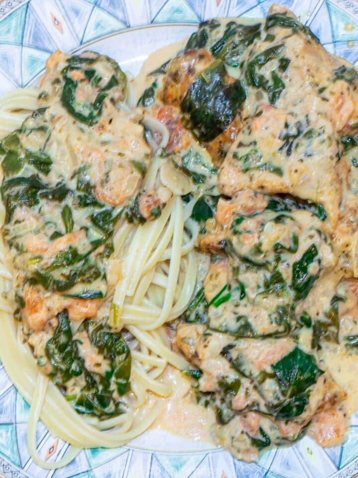 Chicken Florentine with Pasta on a blue green dish