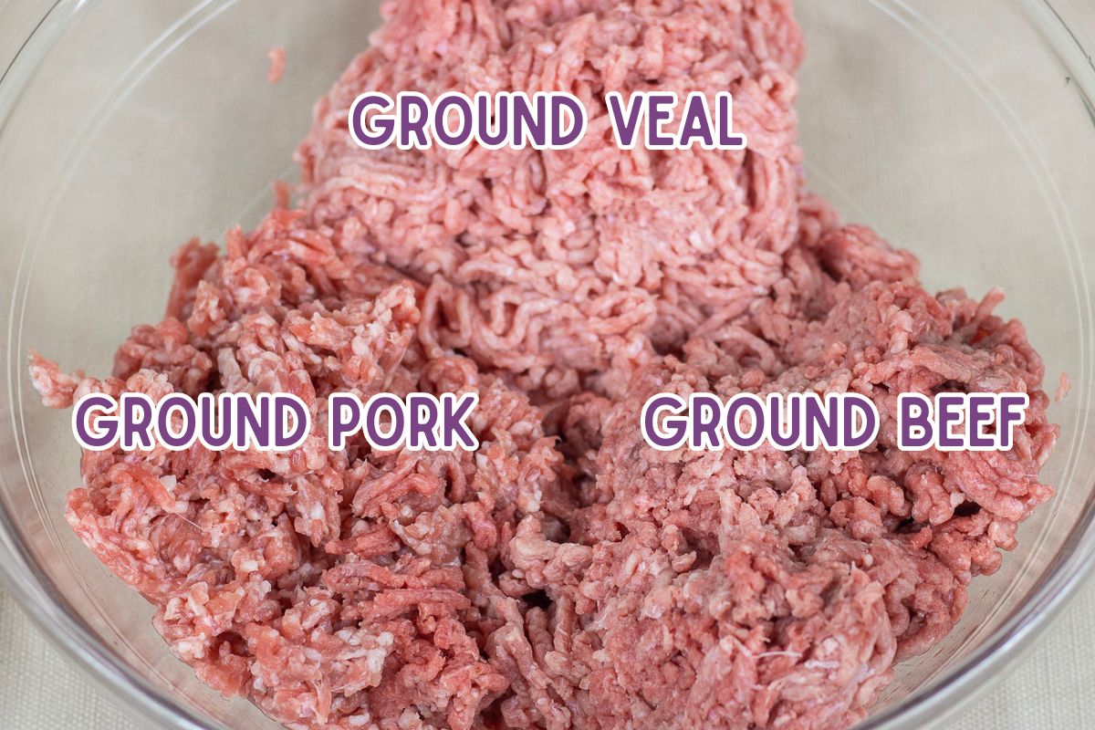 Ground beef, veal, and pork in a bowl.