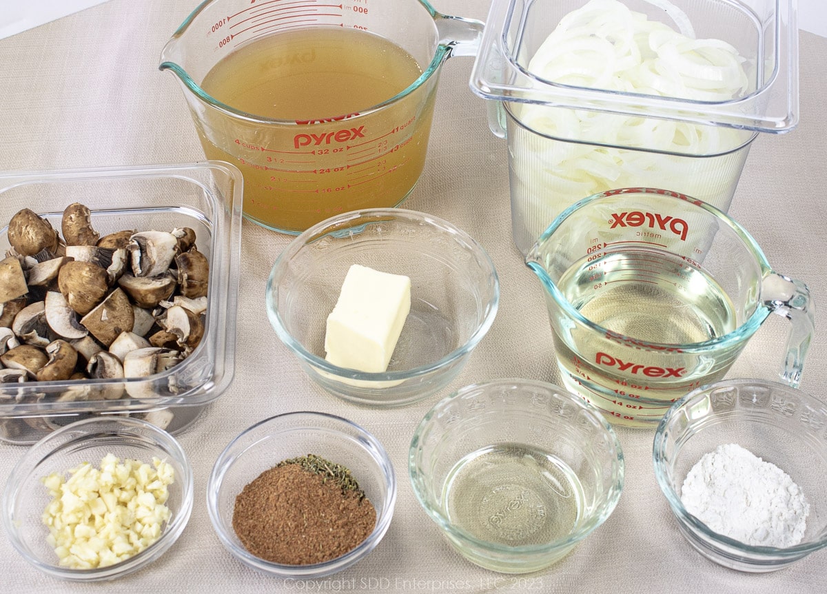 Prepared ingredients for smothered pork chops.