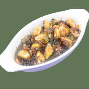 Roasted Brussels Sprouts with Cane Syrup Sauce in a baking dish.