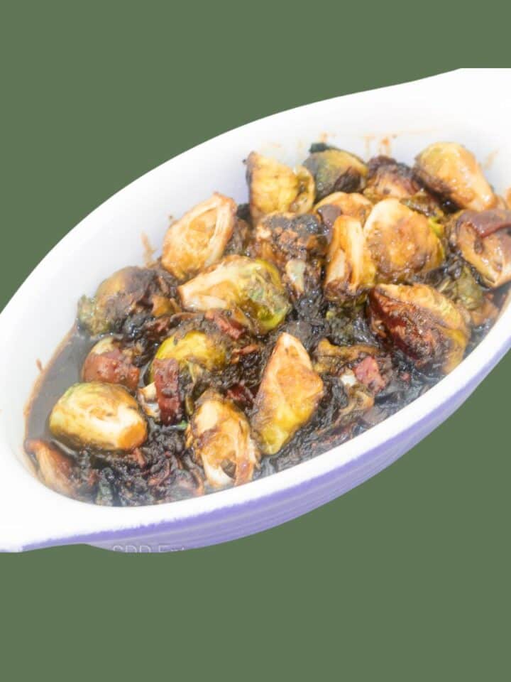 Roasted Brussels Sprouts with Cane Syrup Sauce in a baking dish.