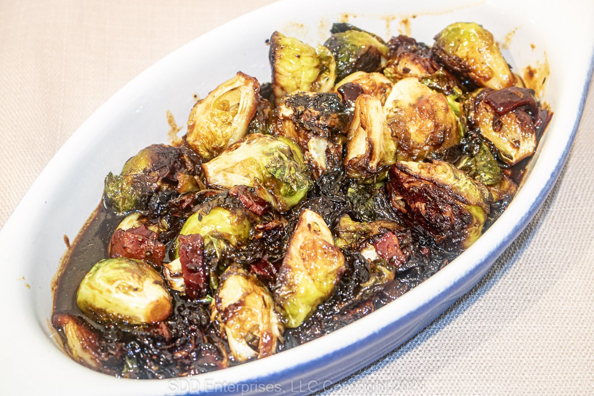Roasted Brussels sprouts with Cane Syrup Sauce in a baking dish.
