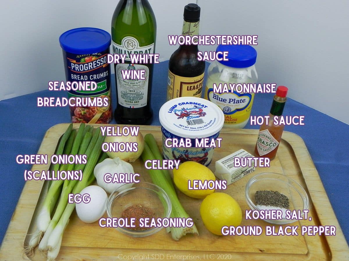 Ingredients to make crabmeat stuffing on a large cutting board.