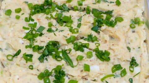 Creamy Cajun Potato Salad in a foil pan.