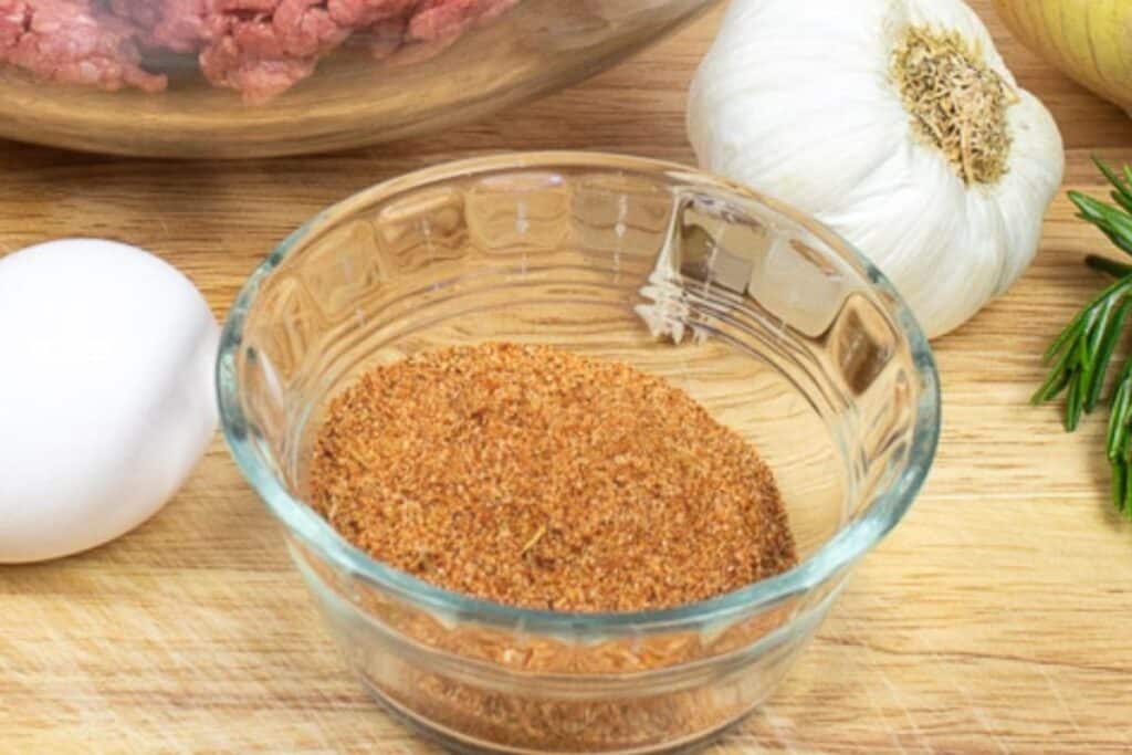 Cajun seasonings in a small glass bowl.