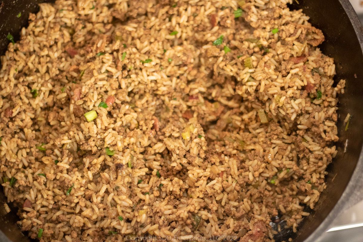 A Dutch oven filled with Dirty Rice.
