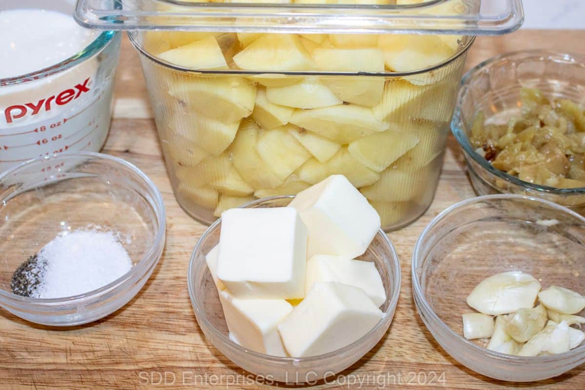 Prepared ingredients for garlic mashed potatoes.