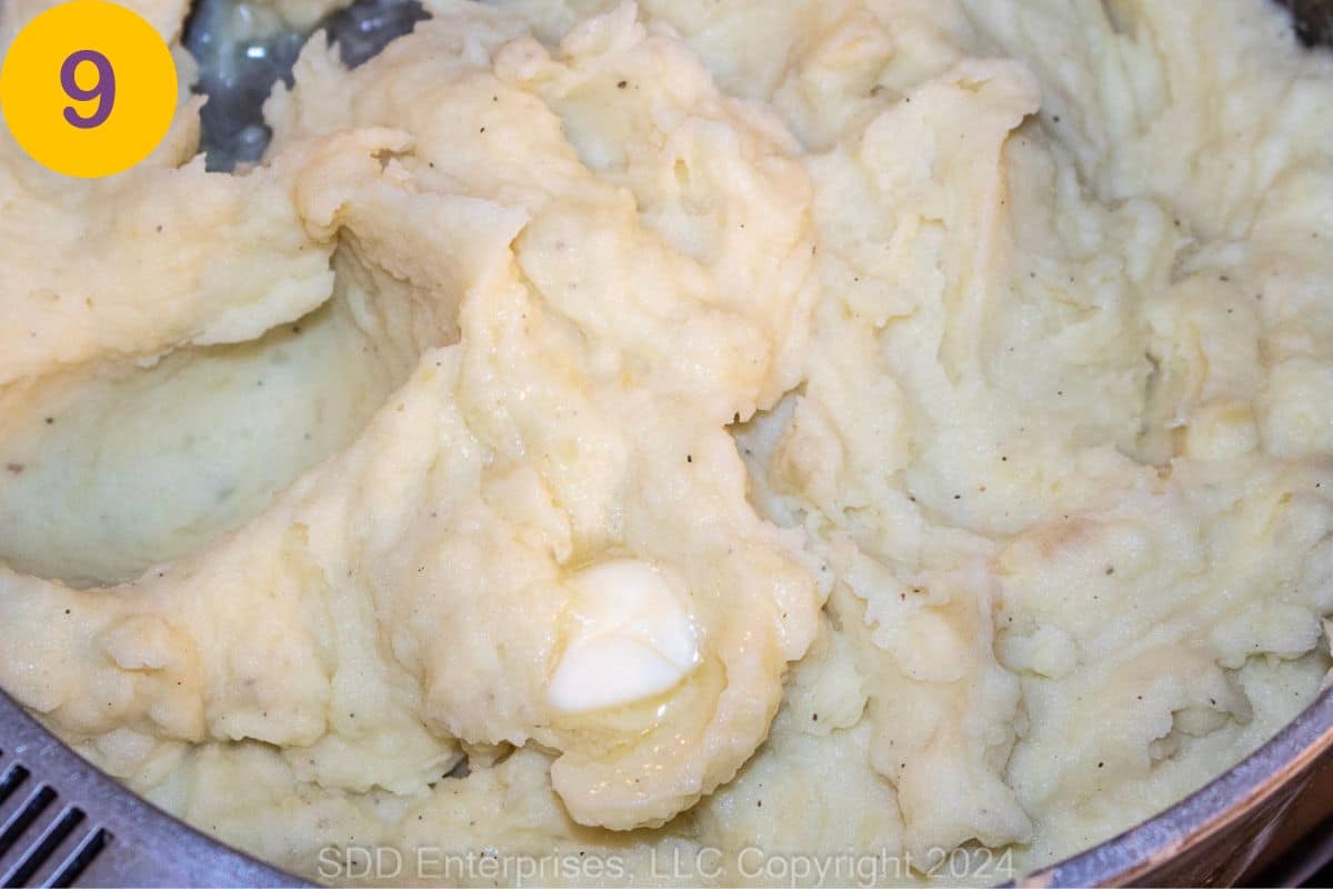 Garlic Mashed Potatoes with butter in a Dutch oven.