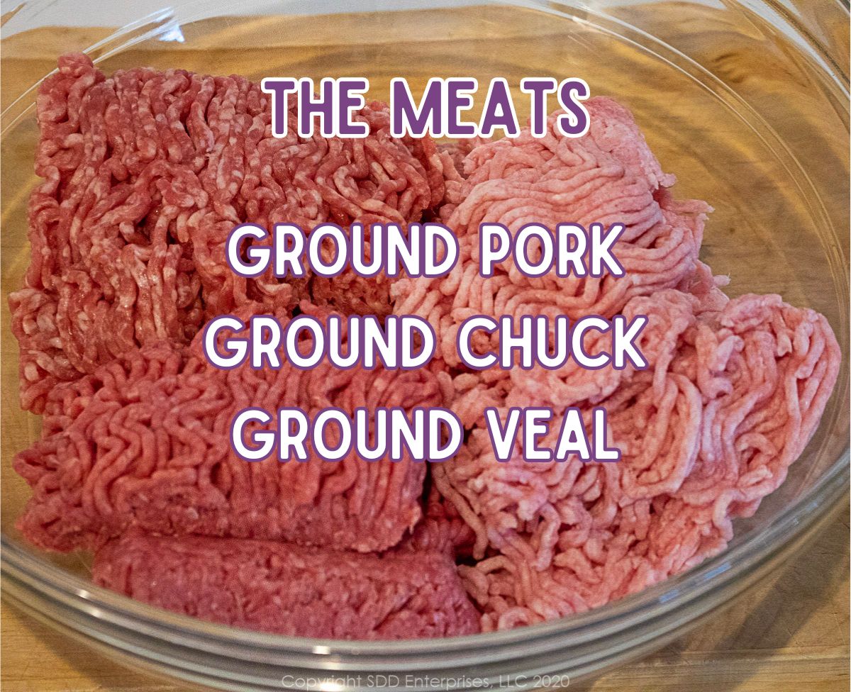 Ground beef, pork, and veal in a glass bowl.