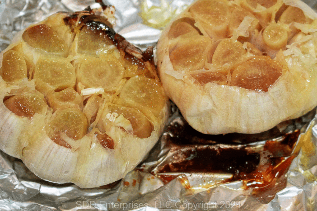 Two roasted heads of garlic.