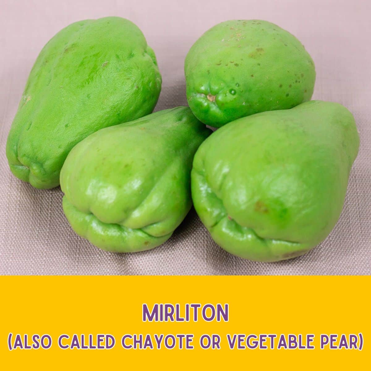 Four fresh mirlitons or vegetable pears.