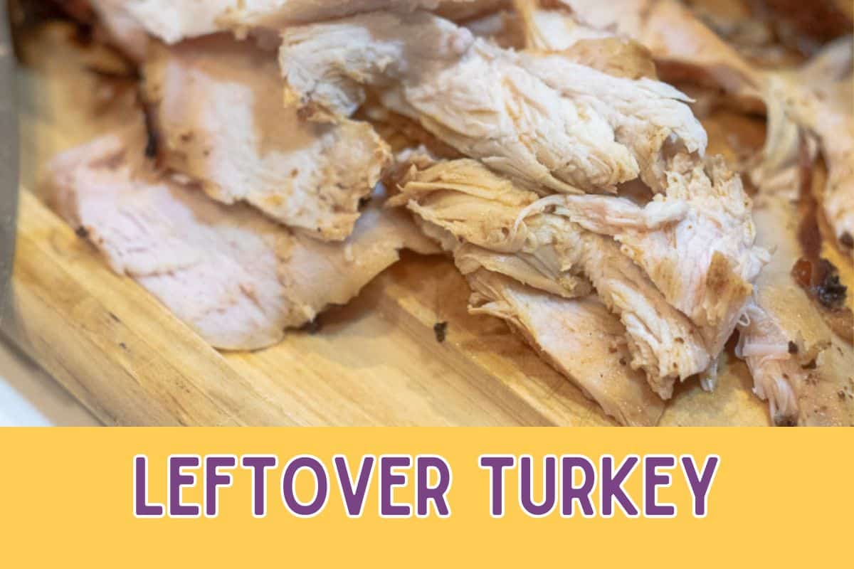 Leftover turkey on a carving board.