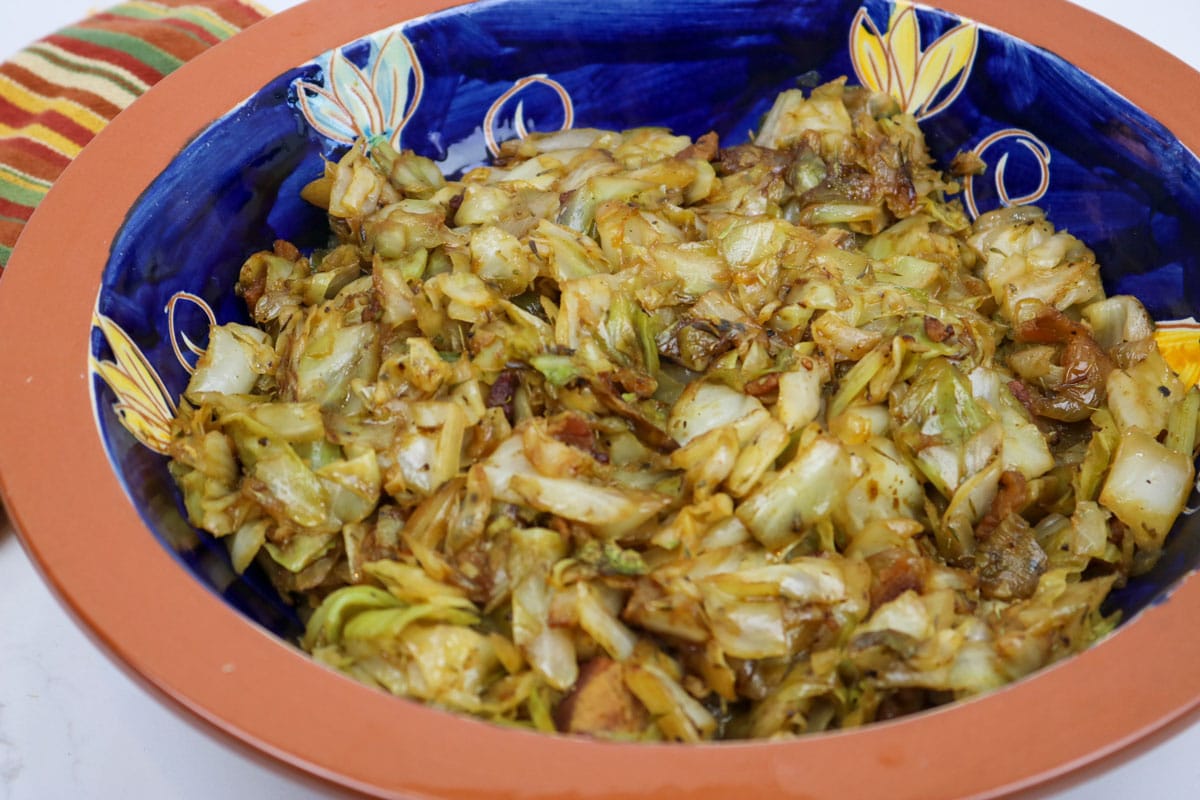 Fried Cabbage with Bacon in a serving bowl.
