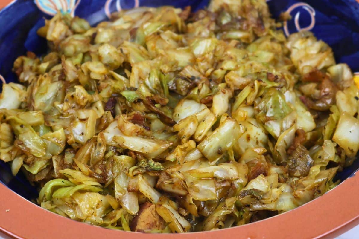 Fried Cabbage with Bacon in a serving bowl.