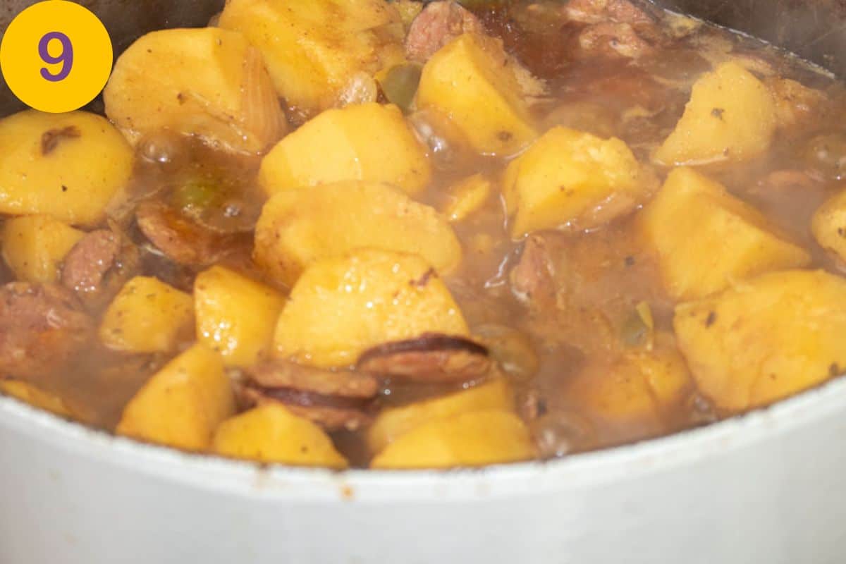 Final step for makings Smothered Potatoes in a Dutch oven.