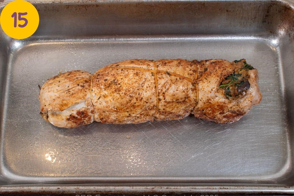 Seared pork tenderloin in a baking pan ready for the oven.