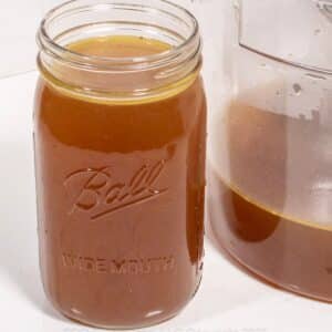 Homemade Chicken Stock in a glass jar.