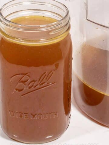 Homemade Chicken Stock in a glass jar.